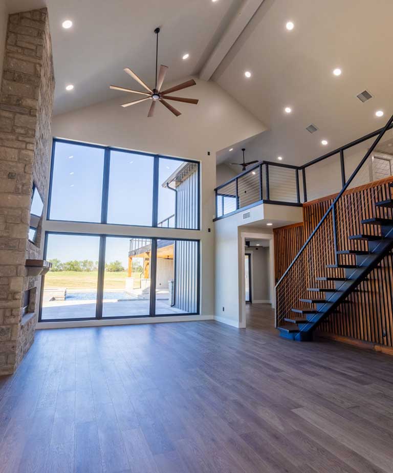 Newly installed hardwood flooring in a barndominium